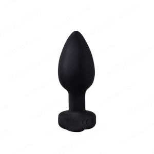 Black silicone butt plug on a white background
